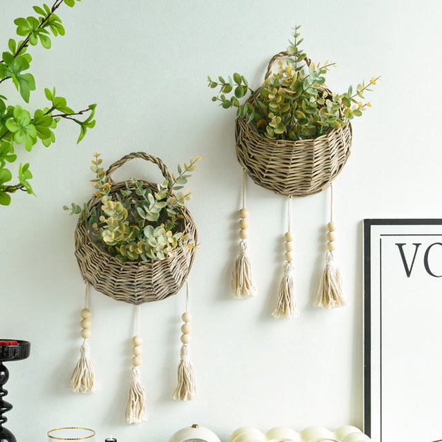 rattan woven bird's nest shaped hanging basket on the wall