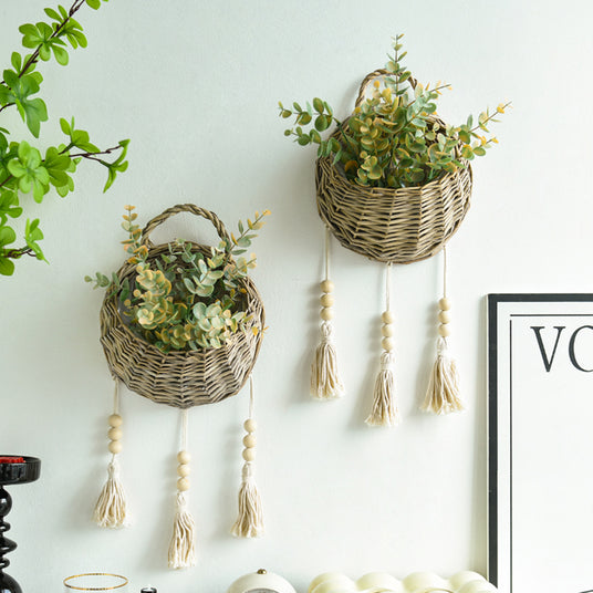 rattan woven bird's nest shaped hanging basket on the wall
