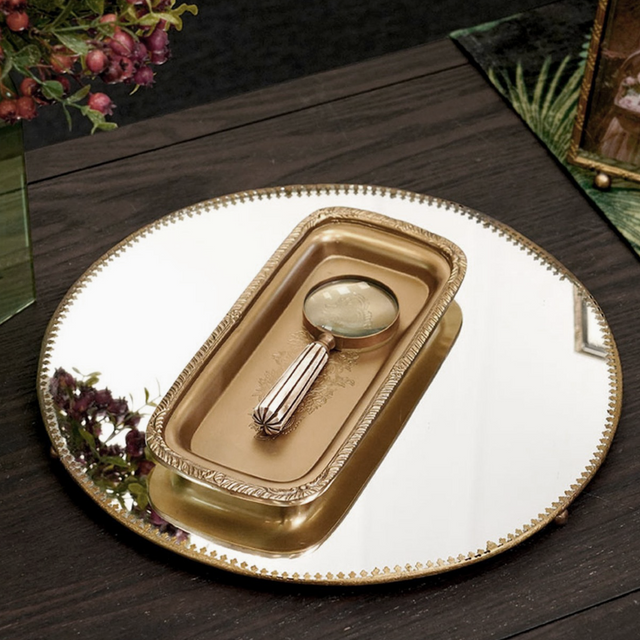 rectangular indian brass embossed serving tray on a mirror