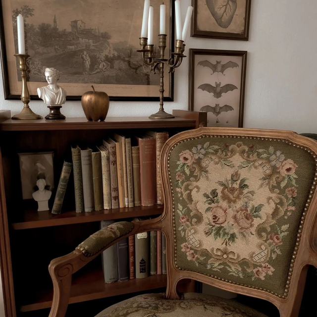 resin apple shaped decorative ornament on the bookshelf