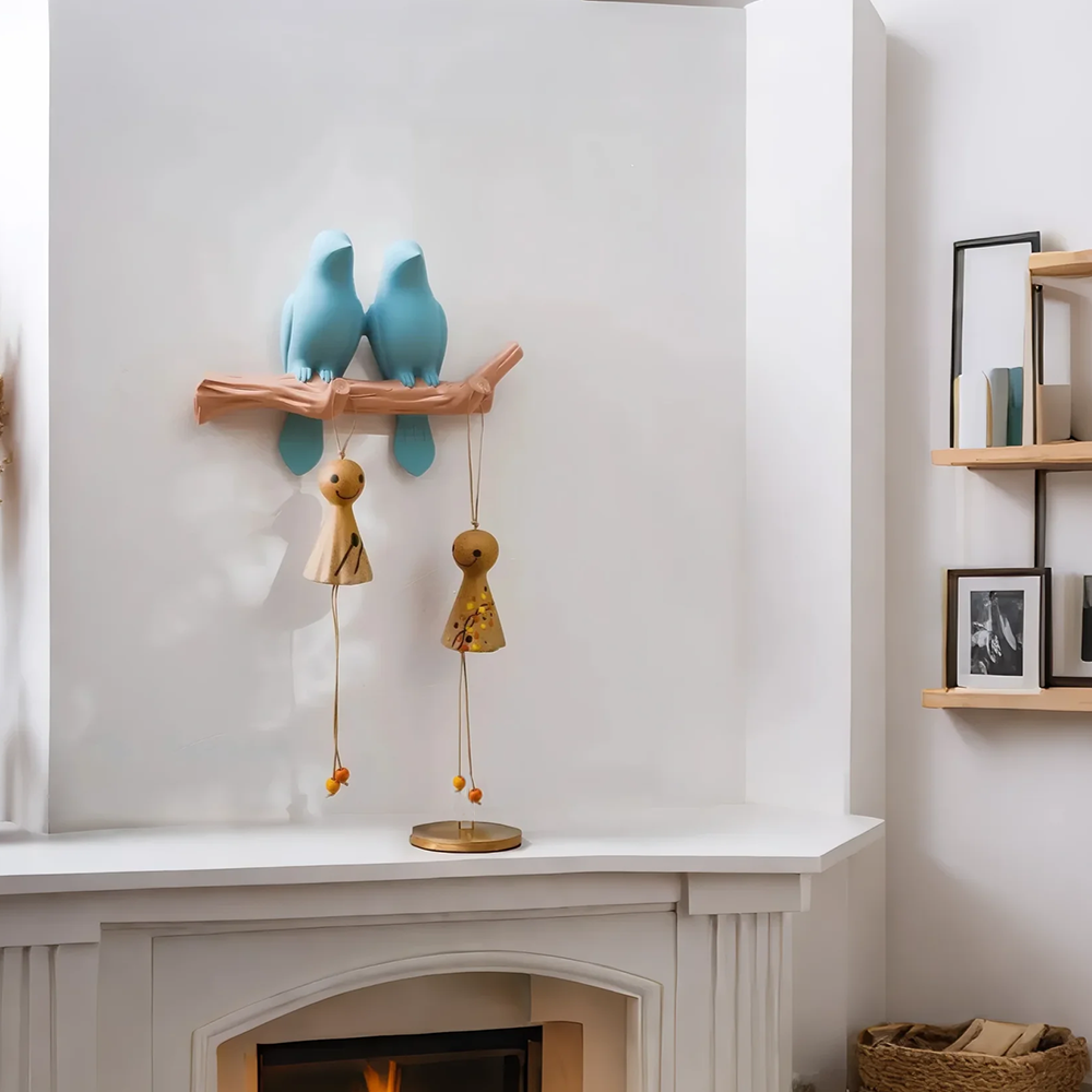 resin bird decorative wall hook above the fireplace