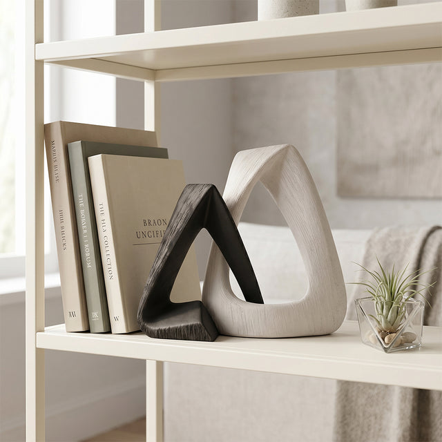 resin sculpture on shelf with books