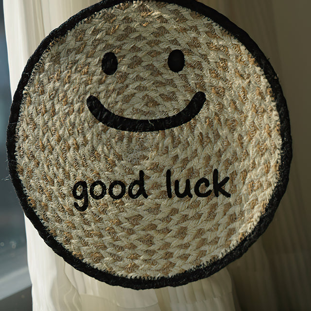 round jute woven smiling face table coaster details