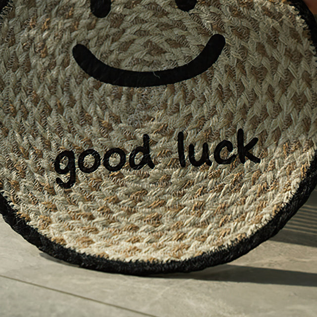 round jute woven smiling face table coaster details
