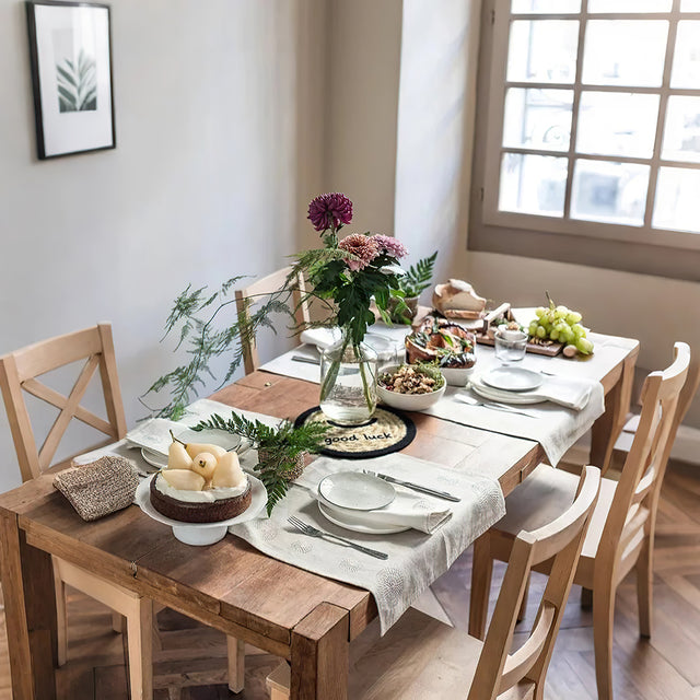 round jute woven smiling face table coaster on the dining table
