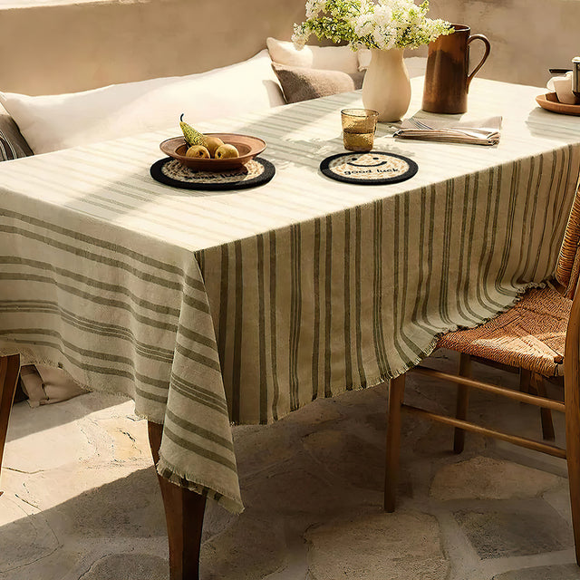 round jute woven smiling face table coaster on the table