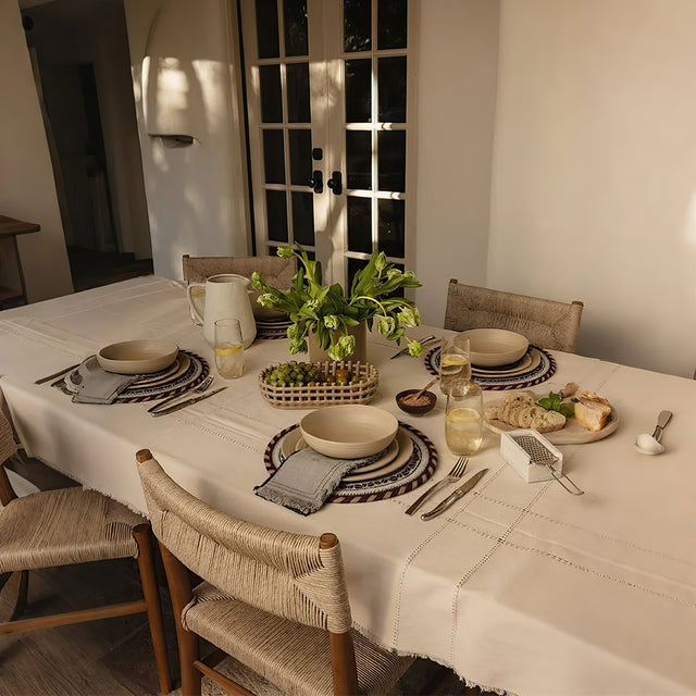 round jute woven table coaster on the dining table