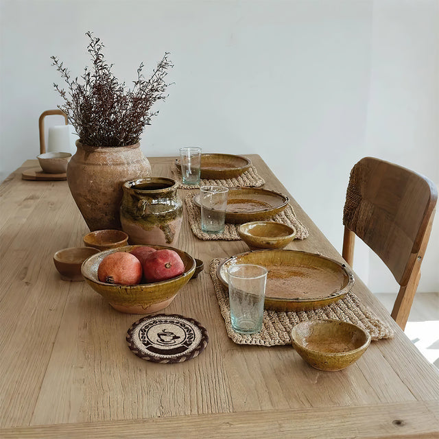 round jute woven table coaster on the table