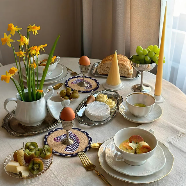round jute woven zebra table coaster on the dining table
