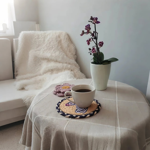 round jute woven zebra table coaster on the table