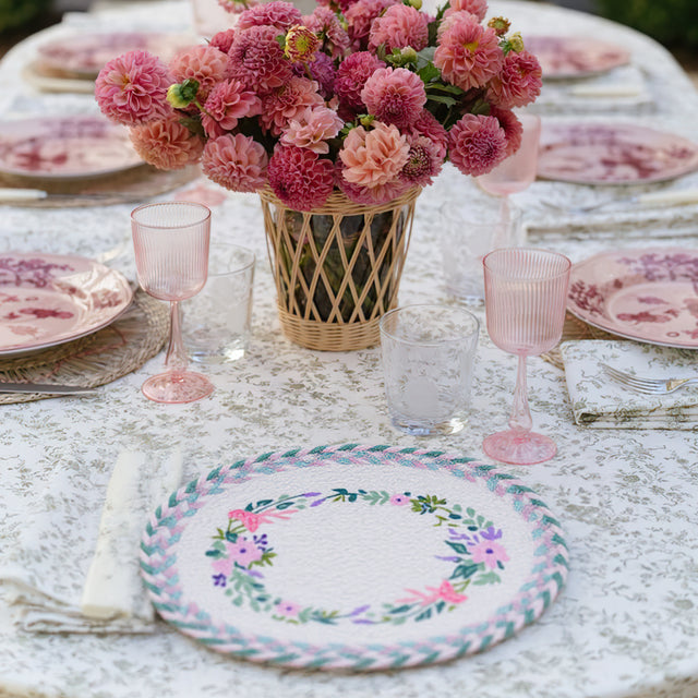 rustic floral woven oval placemat on the dining table