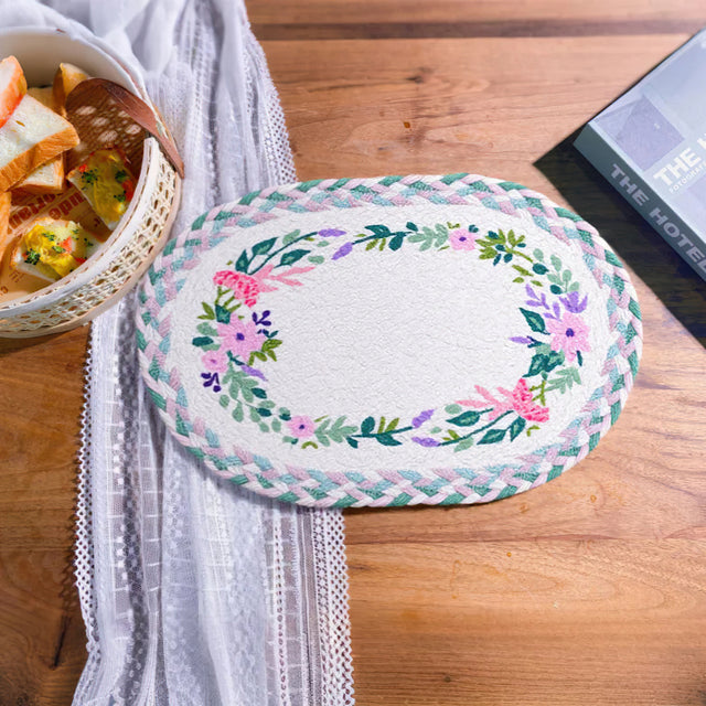 rustic floral woven oval placemat on the table