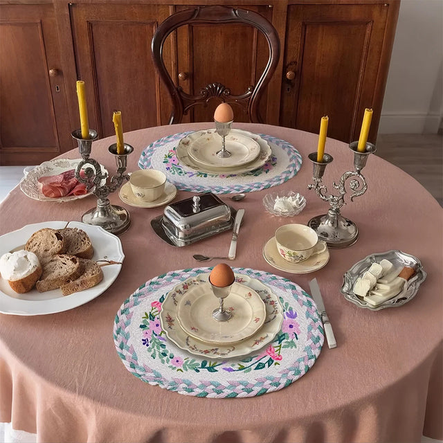 rustic floral woven oval placemat with food
