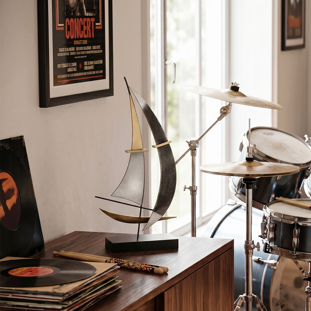 sailboat sculpture on drum music studio table