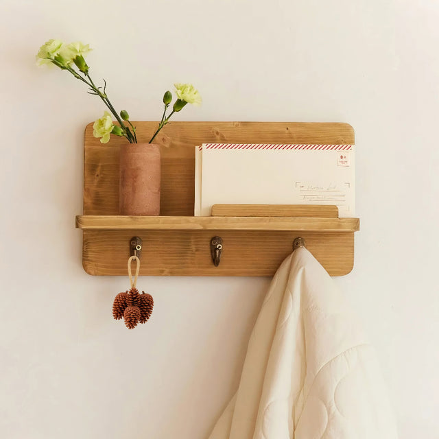 scandinavian pinecone wall decor hang on white wall