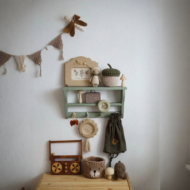 scandinavian pinecone wall decor hang on white wall