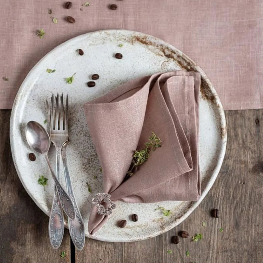 seahorse napkin ring holding cloth napkin