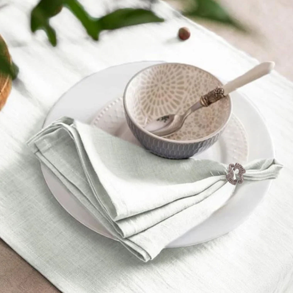 seahorse napkin ring holding cloth napkin