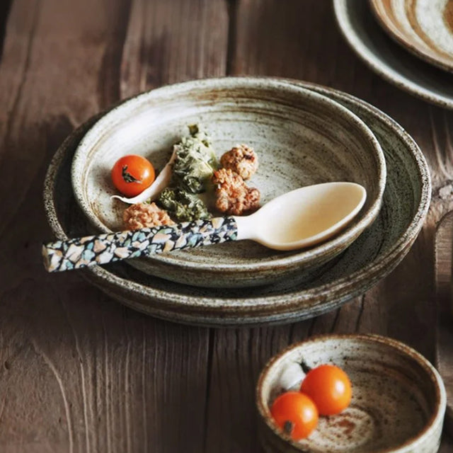 set of 2 natural mother of pearl dessert spoons in the bowl