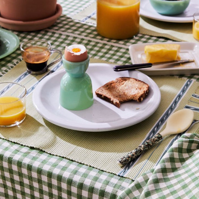 set of 2 natural mother of pearl dessert spoons on the dining table