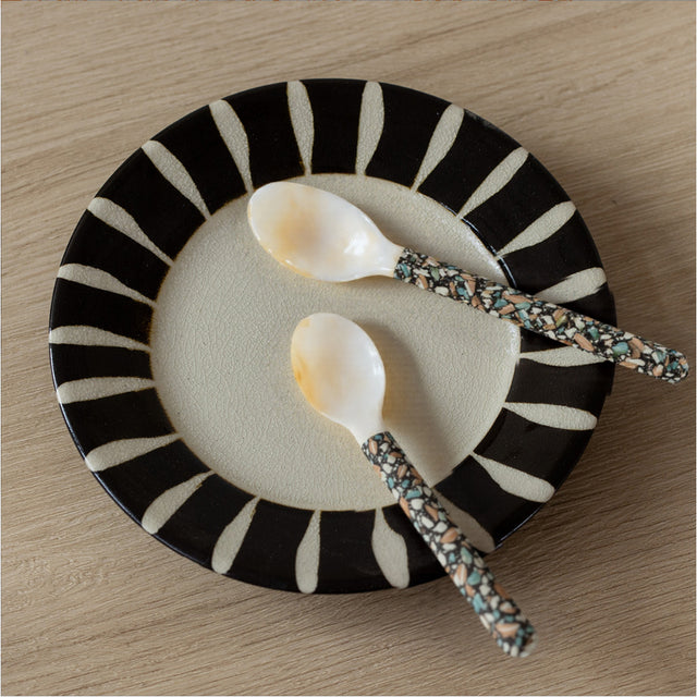 set of 2 natural mother of pearl dessert spoons on the table
