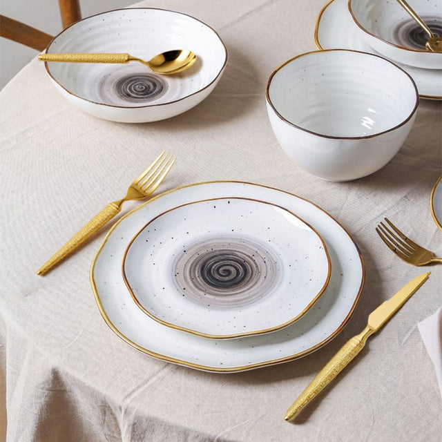 set of 3 stainless steel golden tableware on the dining table