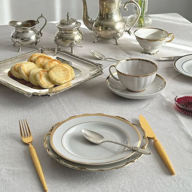 set of 3 stainless steel golden tableware on the dining table