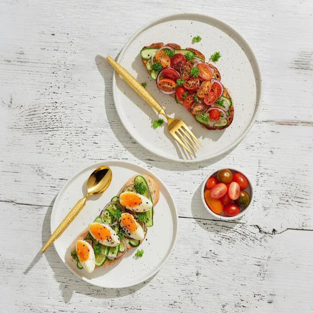 set of 3 stainless steel golden tableware on the table