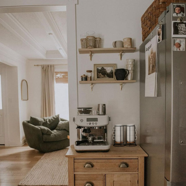 set of 6 white ceramic stacking coffee mugs with black metal on the table