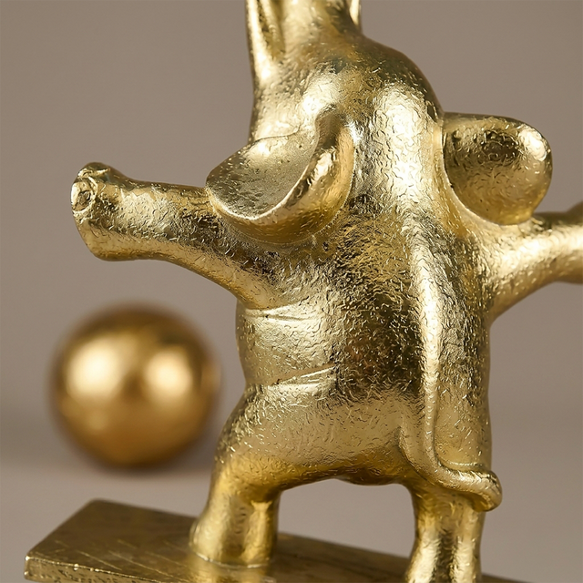 side profile of gold elephant sculpture