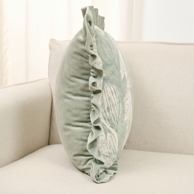 side profile of green ruffle pillow