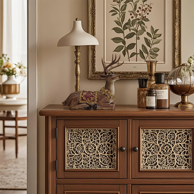 sitting deer figurine on the wooden table