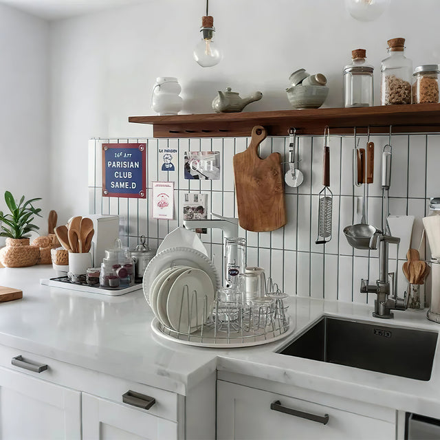 stainless steel dish drying rack with tray in the sink area