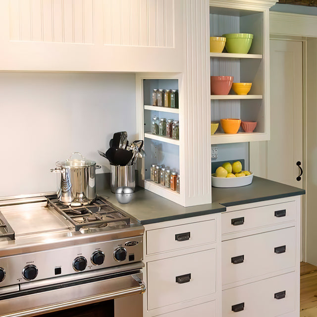 stainless steel mechanical apple baking cooking kitchen timer beside the kitchenware