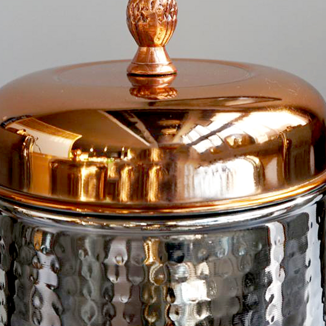 stainless steel sealed coffee storage canister with a pineapple handle details