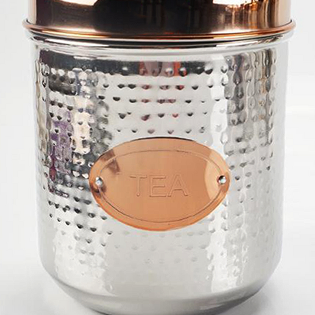 stainless steel sealed tea storage canister with a pineapple handle details