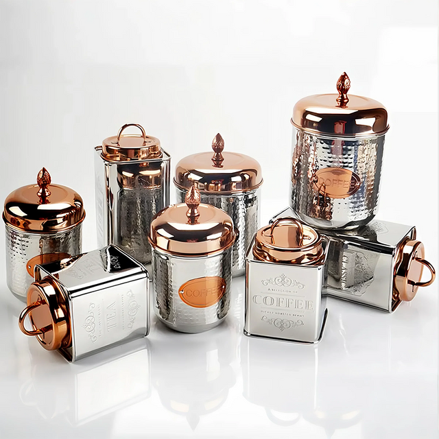 stainless steel sealed tea storage canister with a pineapple handle on the table