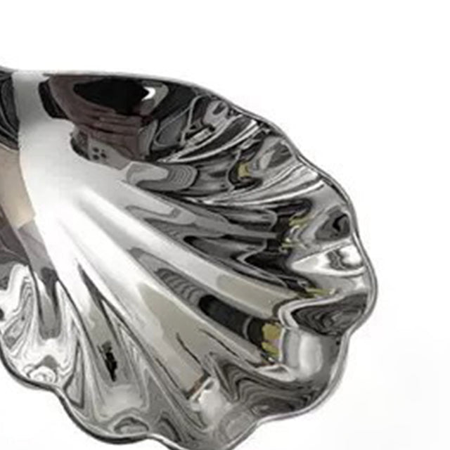 stainless-steel-shell-shaped-spoon-close-up-070501