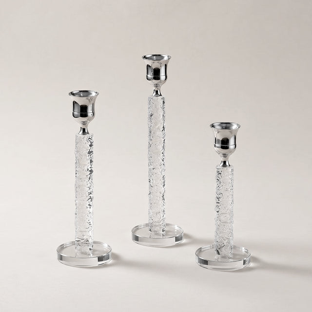 three crystal and silver candle holders