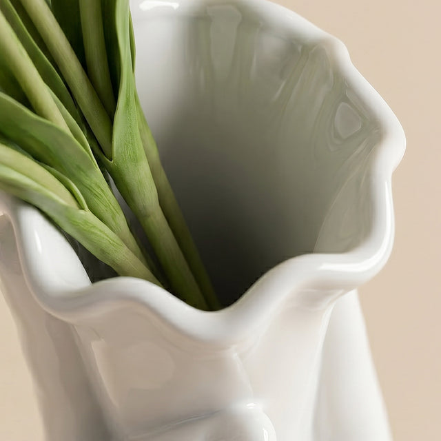 top view of white hand vase floral opening