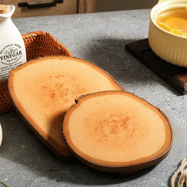 two brown wood coasters on the table