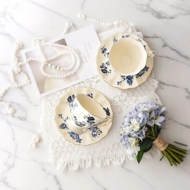 two ceramic floral tea sets on dining table