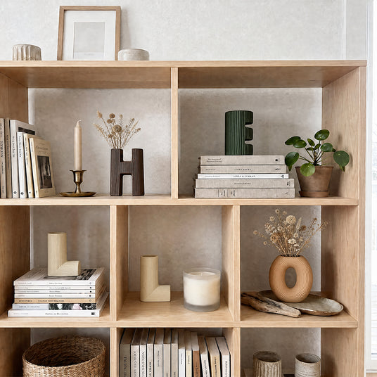 vase in white bookcase grid