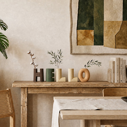vase on wooden table with plants