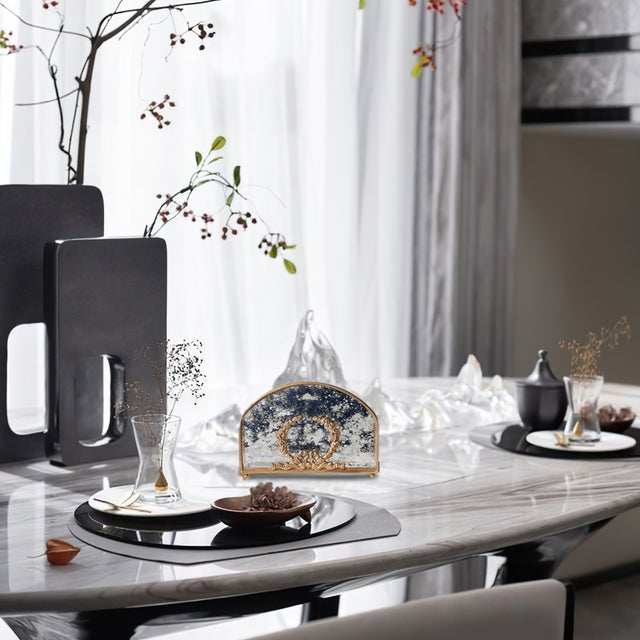 vintage brass carved glass napkin holder on the dining table