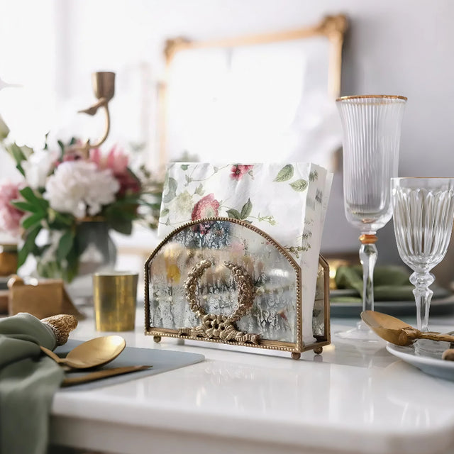 vintage brass carved glass napkin holder storing napkins in the dining table