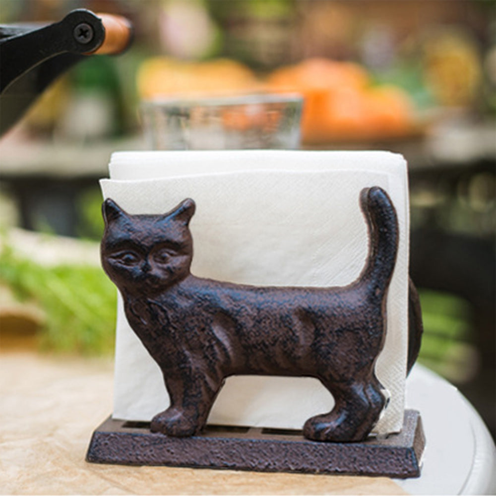 vintage cast iron brown cat shaped napkin holder on the table