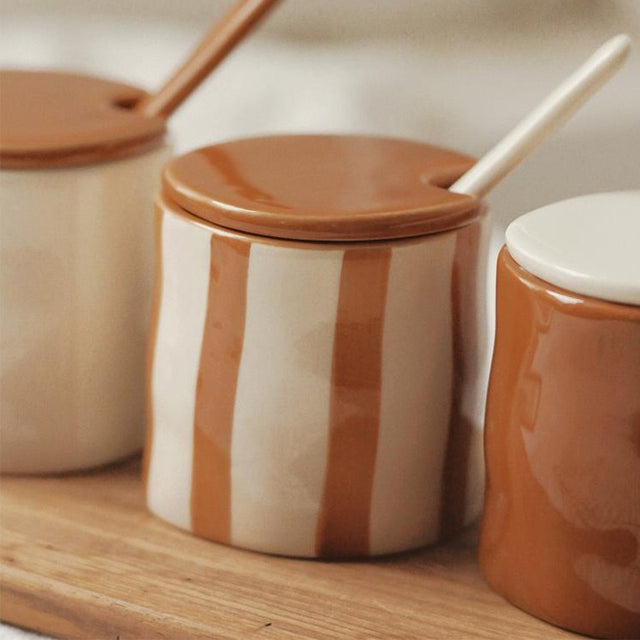 vintage-ceramic-hand-painted-spice-jars-set-with-spoon-wooden-tray-close-up-0610