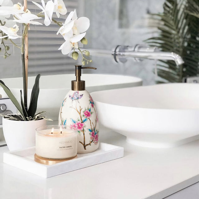 vintage floral ceramic soap dispenser in the bathroom