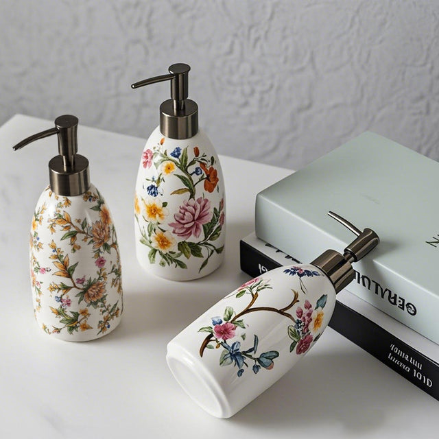 vintage floral ceramic soap dispenser on a table